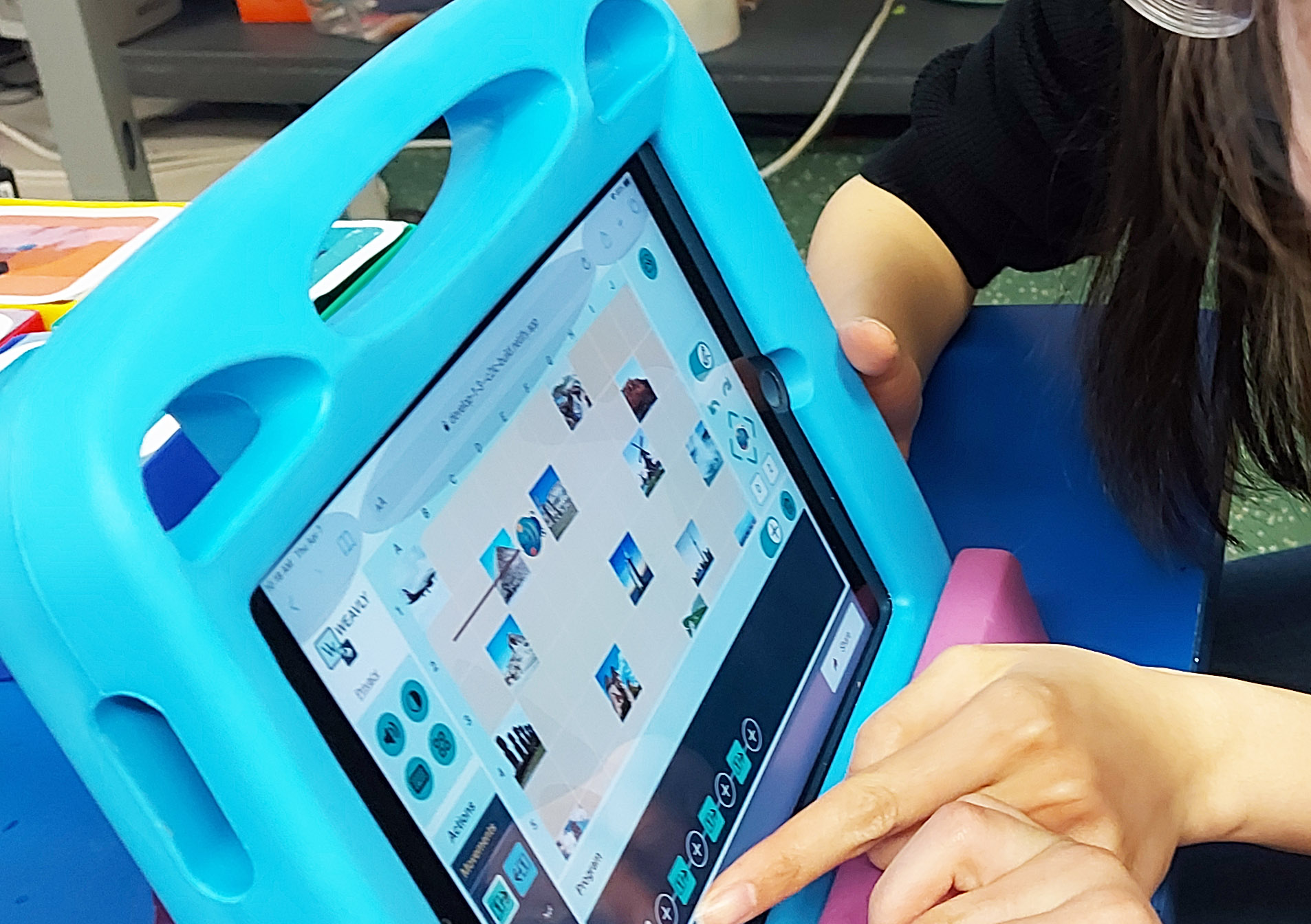 The top broswer area is locked on the iPad screen to minimize accidental navigation. An ipad displaying the Weavly coding environment with the Safari background